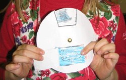 Student using an animal habitat matching wheel