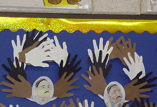 Martin Luther King Jr. friendship wreath made with paper handprints and a portrait
