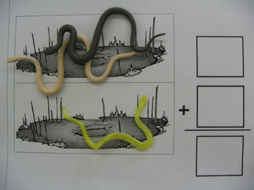 Addition math mat with rubber snake manipulatives